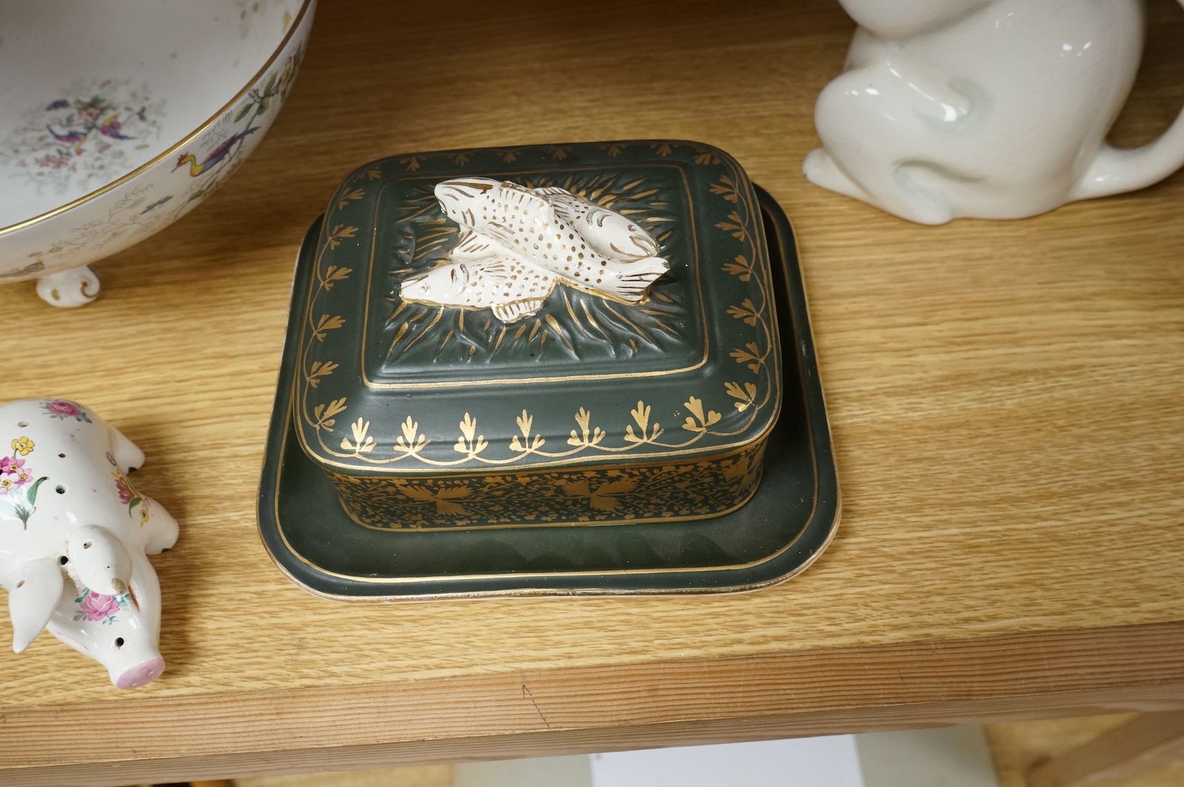 A collection of porcelain and pottery to include commemorative china, a leaf dish and group of wade figures, largest 29cm in diameter